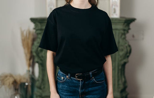 Person in Black Crew Neck T-shirt and Blue Denim Jeans